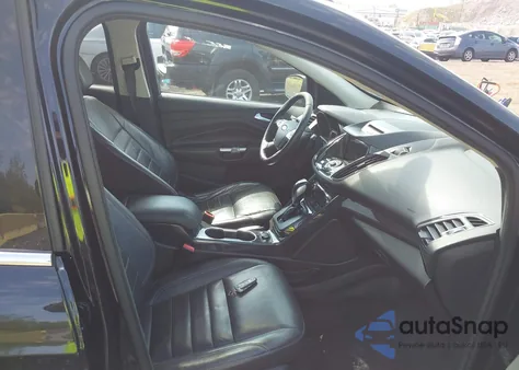 2016 Ford Escape Titanium z USA, uszkodzony, nr VIN 1FMCU9J90GUC16559